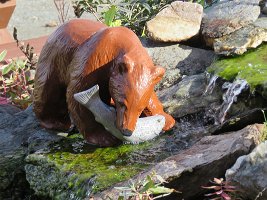IMG 6514  Bear catching salmon figurine in water garden, (Closest we got to seeing a bear catching a salmon) Tangle River Inn, Tangle Lakes, AK