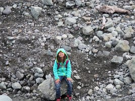 IMG 6745  Megan resting on rocks by the side of Root Glacier, Wrangell-St. Elias National Park, AK