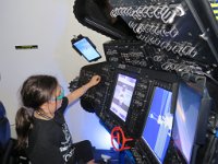 IMG_7487 Megan operating Starliner Simulator, Boeing booth, FIRST Robotics 2019 National Championships, George R Brown Convention Center, Houston, TX