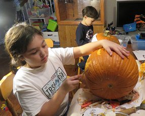 IMG_5391 Megan removing rind from pumpkin